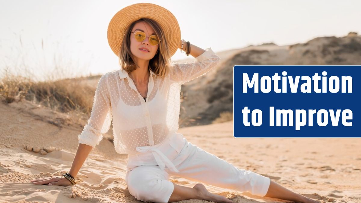 Stylish beautiful woman in desert sand in white outfit wearing straw hat on sunset.